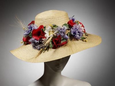 Natural straw broad-brimmed hat trimmed with fabric flowers and wheat