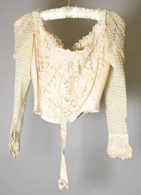 Cream satin wedding dress, 1900, USA; New York City, designed by W. Mulhall, worn by Charlotte Mabel Dwight at her wedding on 26 April 1900
