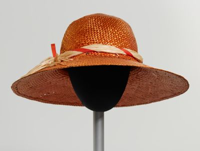 Orange straw hat with raffia hat band