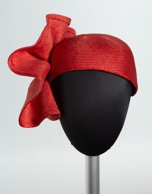 Red straw skullcap with matching ruffle flower