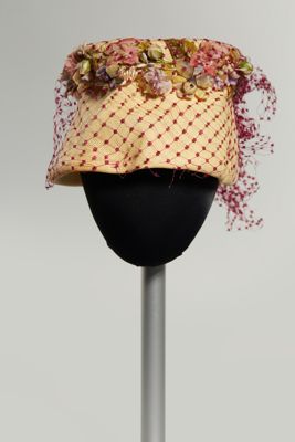 Plastic straw hat with net and fabric flowers