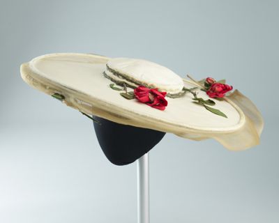 Cream hat with wide brim and red fabric flowers